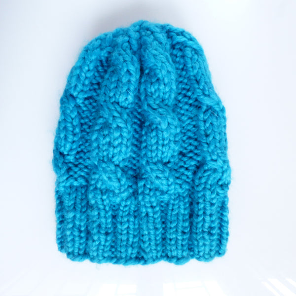 Knitted hat - sky blue with cables